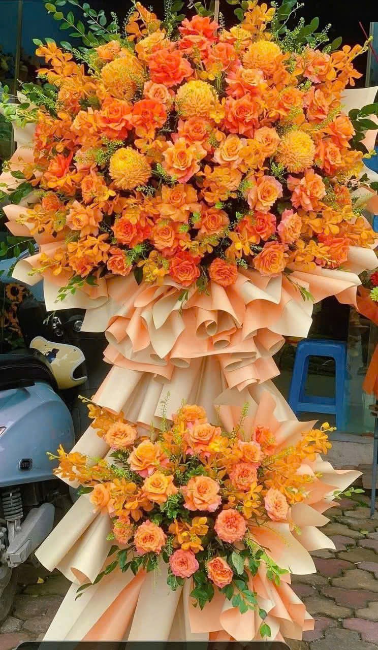 Kệ khai trương màu cam mix hoa lan