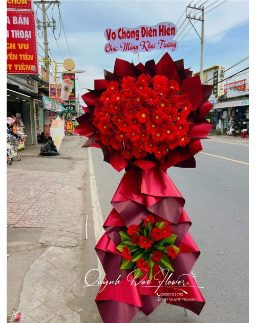 Kệ khai trương tone đỏ, khai trương hoa đồng tiền 