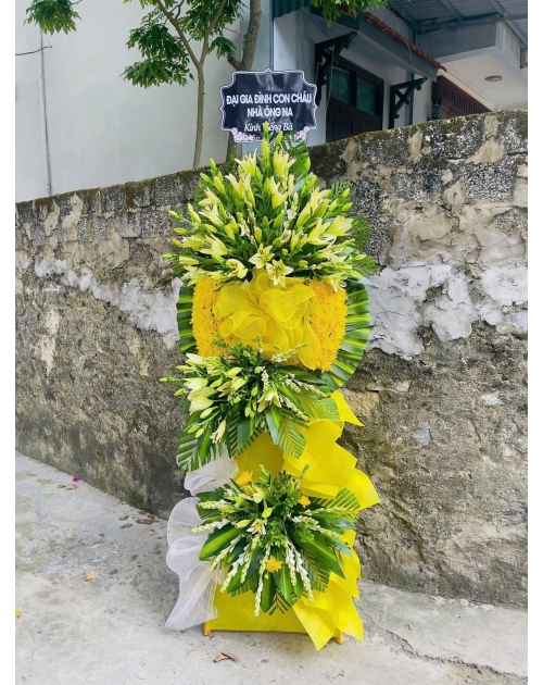 Kệ viếng màu vàng  mix hoa cúc và hoa ly